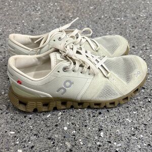 On Running Cream and Tan Athletic Shoes